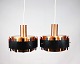 A pair of pendants in copper and black metal of danish design from the 1970s.
