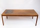 Coffee table in teak with brown ceramic tiles of danish design from the 1960s.

