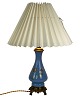 Table lamp with blue opal frame decorated with gold and of bronze, with paper 
shade, from the 1890s. 
Great condition
